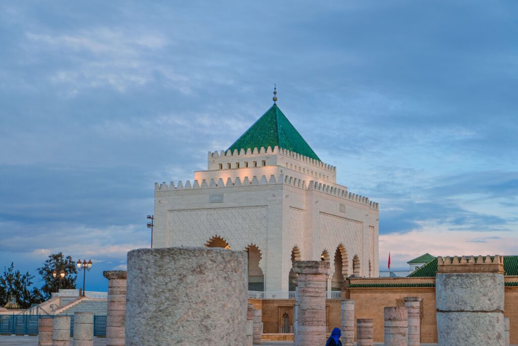 Historic Hassan Tower with Mausoleum in Rabat, Morocco at sunset, capturing Moroccan architecture.