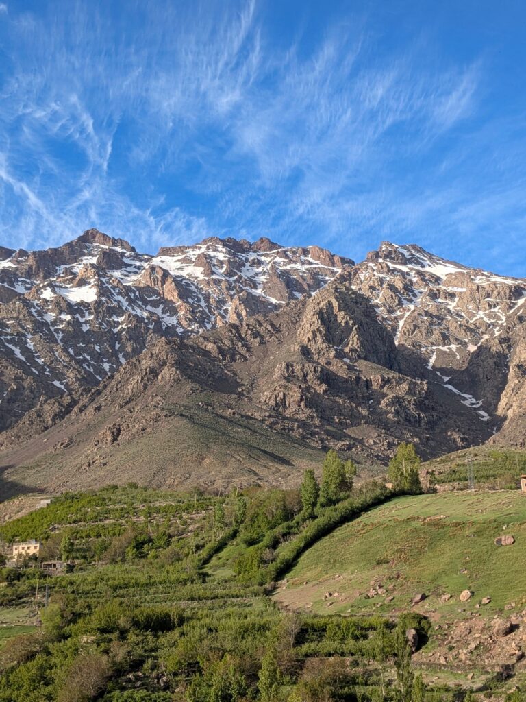 Breathtaking landscape of the Atlas Mountains with clear blue skies in Tachdirt, Morocco.